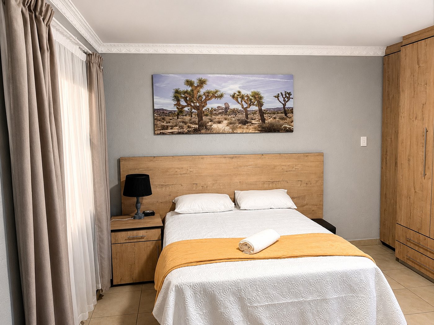 Deluxe Double Room bed at Mashobs Guest House